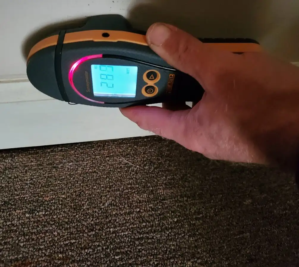 Moisture detection at baseboard during Storm Damage Restoration in Bismarck